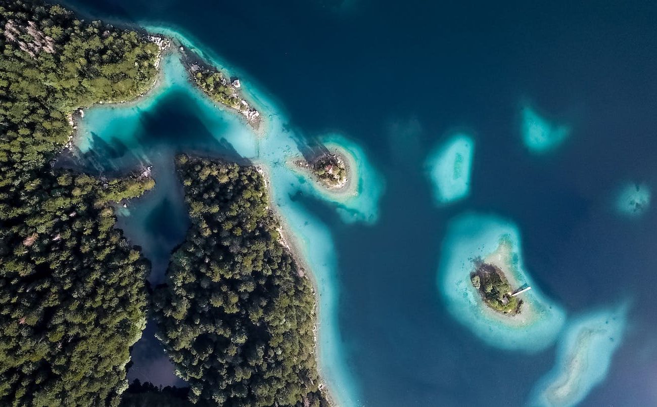 Aerial view of a Bahamian island and the ocean around it.